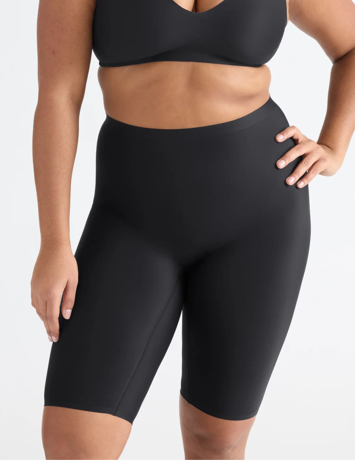 Front view of model wearing the Leakproof Thigh Saver® 10”, highlighting the coverage and smooth fit – Black – view 1 of 13