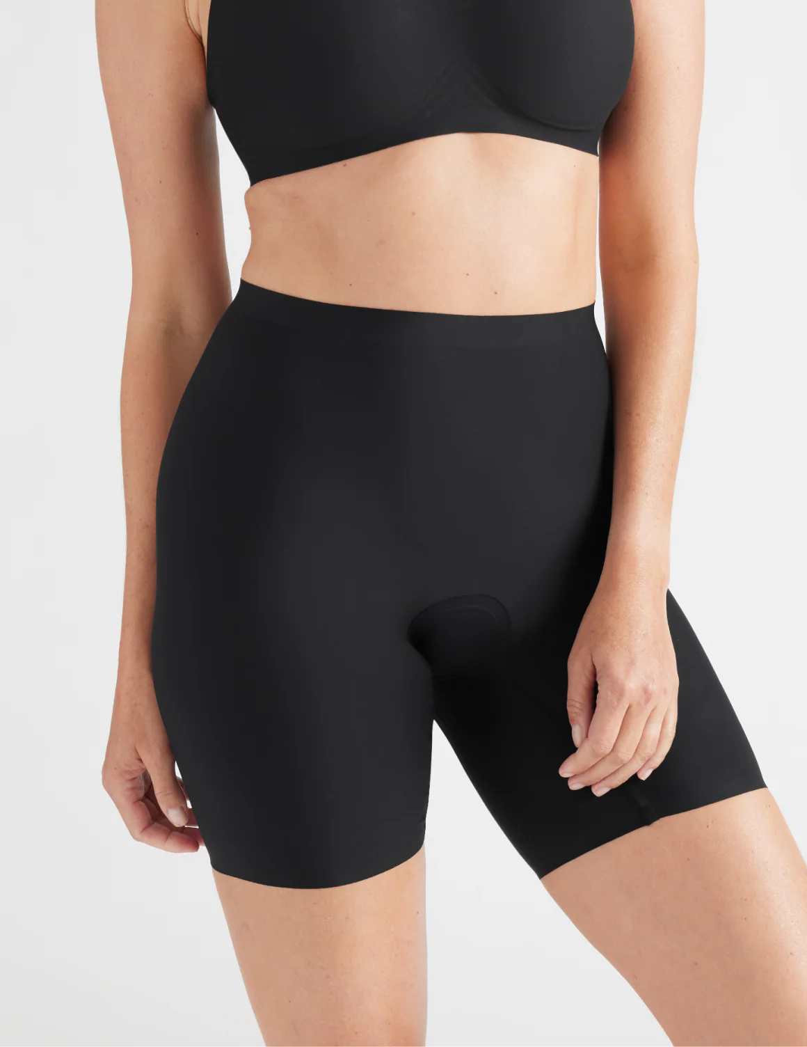 Front view of model wearing the Leakproof Thigh Saver® 6” highlighting the coverage and smooth fit – Black – view 1 of 32