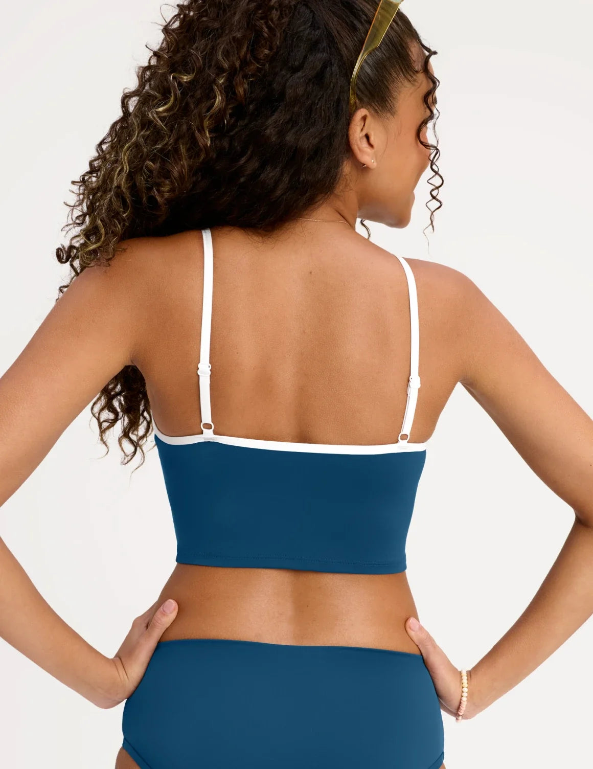 Back view of model wearing the Teen Scoop Tankini Top highlighting the coverage and fit – Blue Coast – view 8 of 16