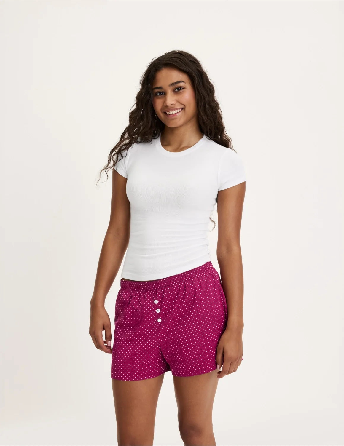 Front view of model wearing the Teen Super Leakproof® Sleepover Boxer highlighting the coverage and fit – Candy Heart – view 4 of 39