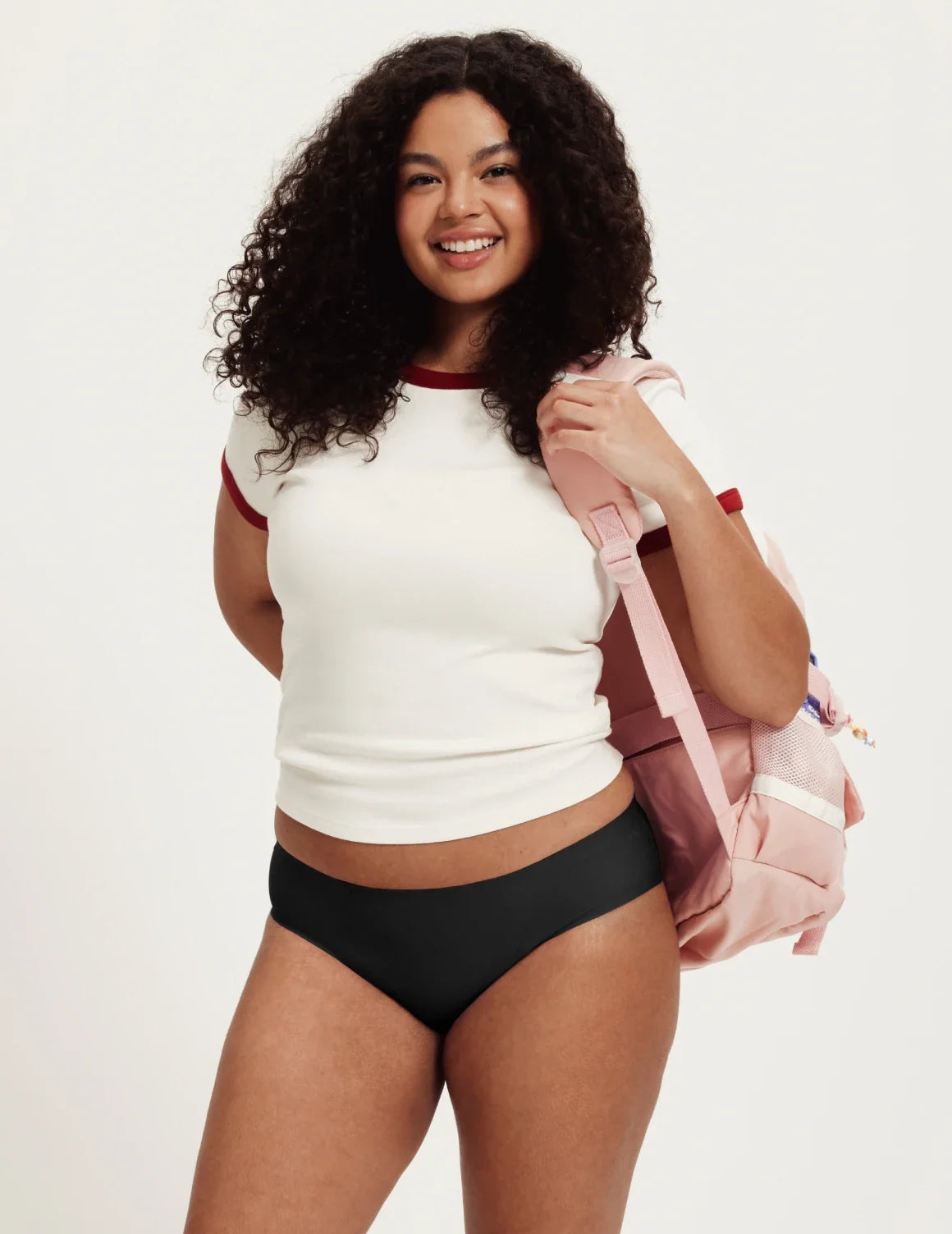 Front view of model wearing the Teen SuperPlus Leakproof® No-Show Bikini highlighting the coverage and smooth fit – Black – view 2 of 16