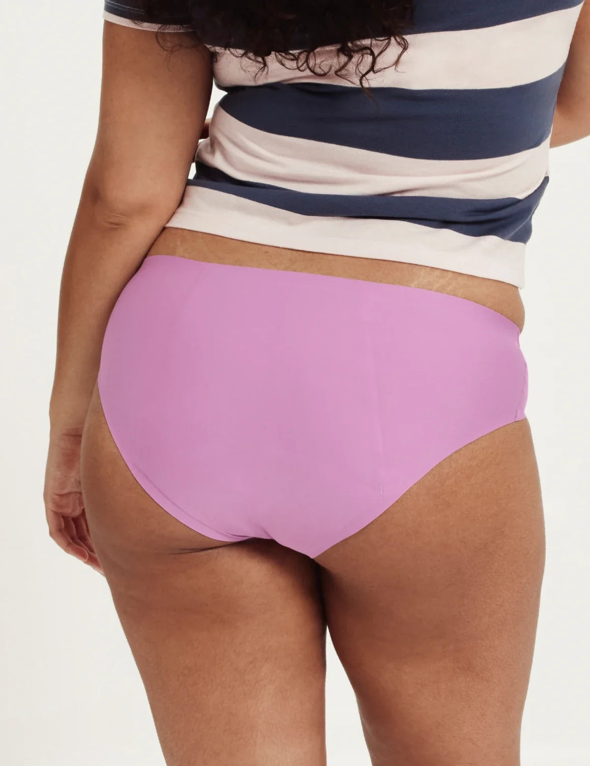 Back view of model wearing the Teen SuperPlus Leakproof® No-Show Bikini highlighting the coverage and smooth fit – Cosmo – view 11 of 16