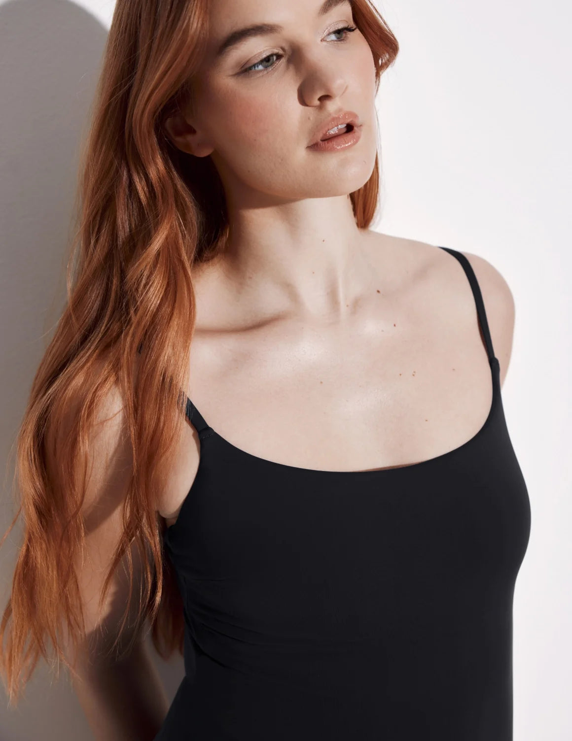 Front view of model wearing the Leakproof Classic One Piece Swimsuit highlighting the neckline, coverage and fit – Black – view 7 of 8
