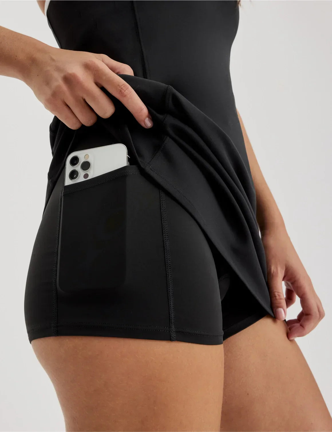 Front view of model wearing the Teen First Serve Sport Dress highlighting the coverage and fit – Black – view 7 of 12