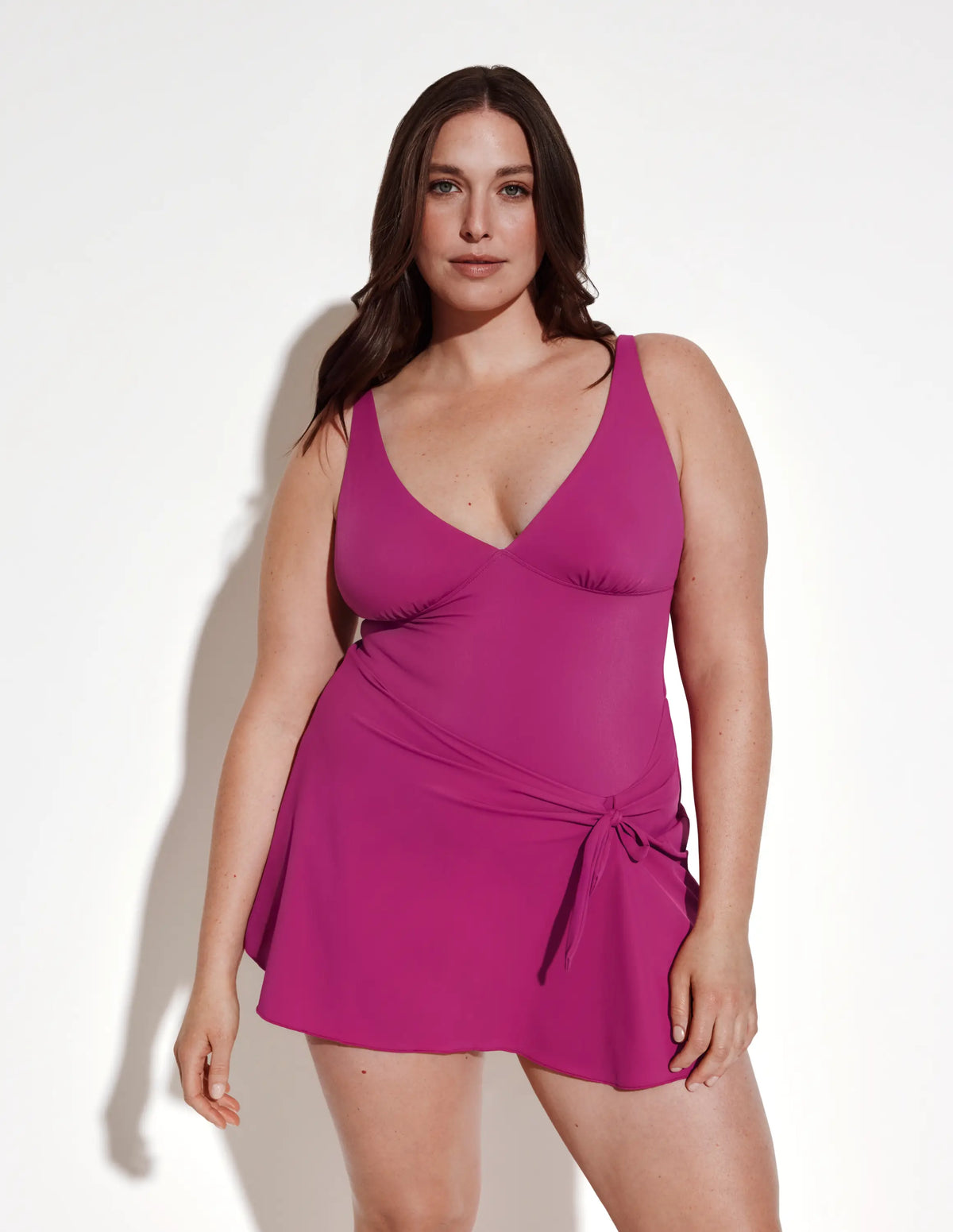 Front view of model wearing the Leakproof Sculpt Deep V Swim Dress highlighting the coverage and fit – Deep Orchid – view 5 of 12