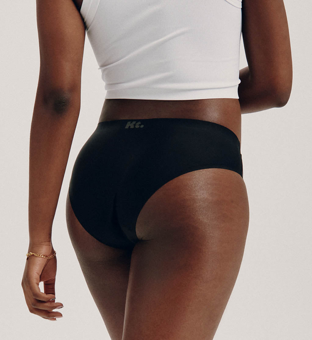 Back view of model wearing the Teen Light Leakproof No-Show Bikini highlighting the coverage and smooth fit – Night Sky/Beige/Black – view 3 of 28