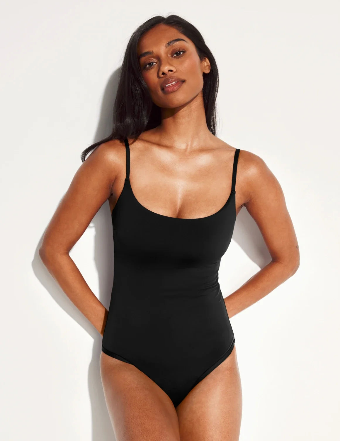 Front view of model wearing the Leakproof Sculpt Classic One Piece Swimsuit highlighting the neckline, coverage and fit – Black – view 4 of 22