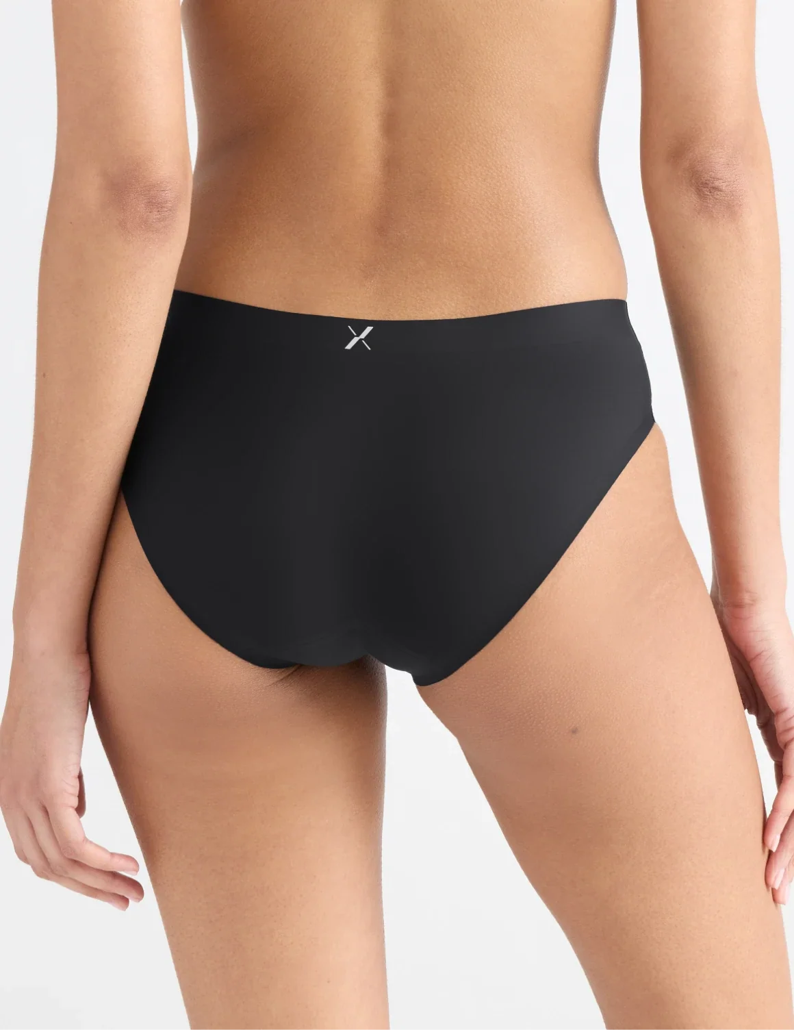 Back view of model wearing the Leakproof UltraThin No-Show Bikini highlighting the coverage and smooth fit – Black – view 6 of 47