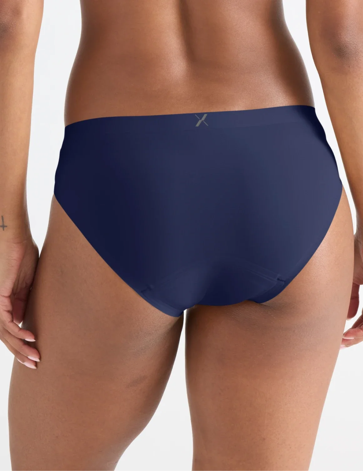 Back view of model wearing the Leakproof UltraThin No-Show Bikini highlighting the coverage and smooth fit – Midnight – view 9 of 47