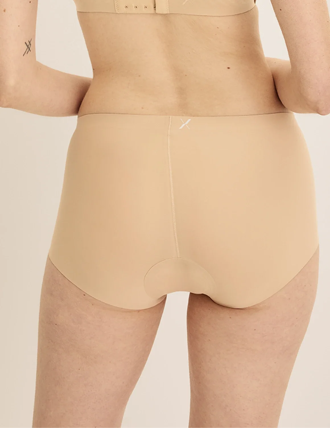 Back view of model wearing the Leakproof UltraThin No-Show Boybrief highlighting the coverage and smooth fit – Warm Sand – view 7 of 12