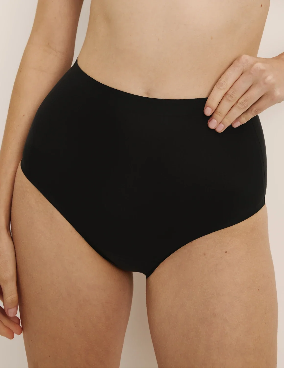 Front view of model wearing the Leakproof UltraThin No-Show High Rise highlighting the coverage and smooth fit – Black – view 4 of 40