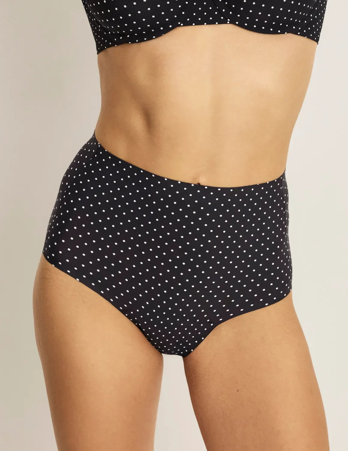 Front view of model wearing the Leakproof UltraThin No-Show High Rise highlighting the coverage and smooth fit – Black with White Polka Dot – view 1 of 40