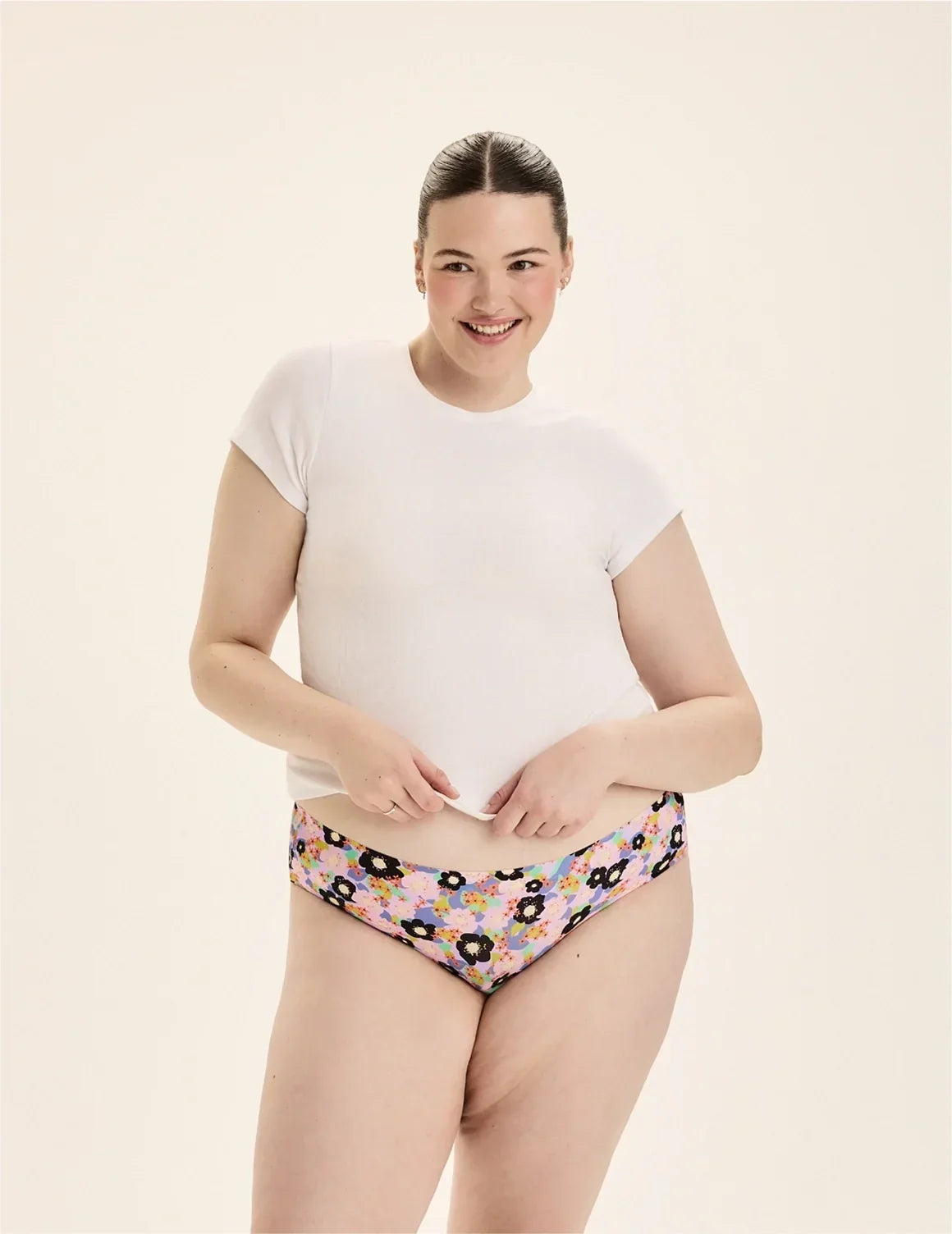 Front view of model wearing the Teen Leakproof UltraThin No-Show Bikini highlighting the coverage and smooth fit – Electric Orchid – view 2 of 72