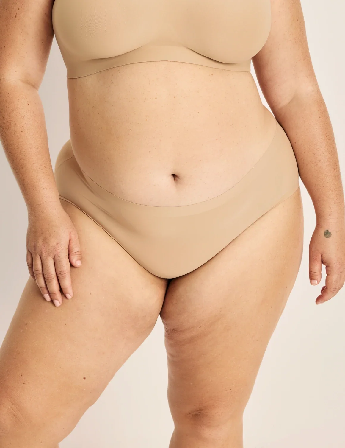 Front view of model wearing the Light Leakproof No-Show Boyshort highlighting the coverage and smooth fit – Warm Sand – view 10 of 17