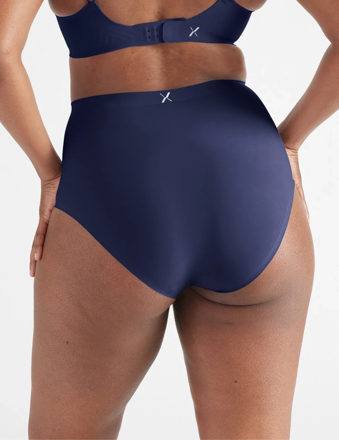 Back view of model wearing the Light Leakproof No-Show High Rise highlighting the coverage and smooth fit – Midnight – view 7 of 20