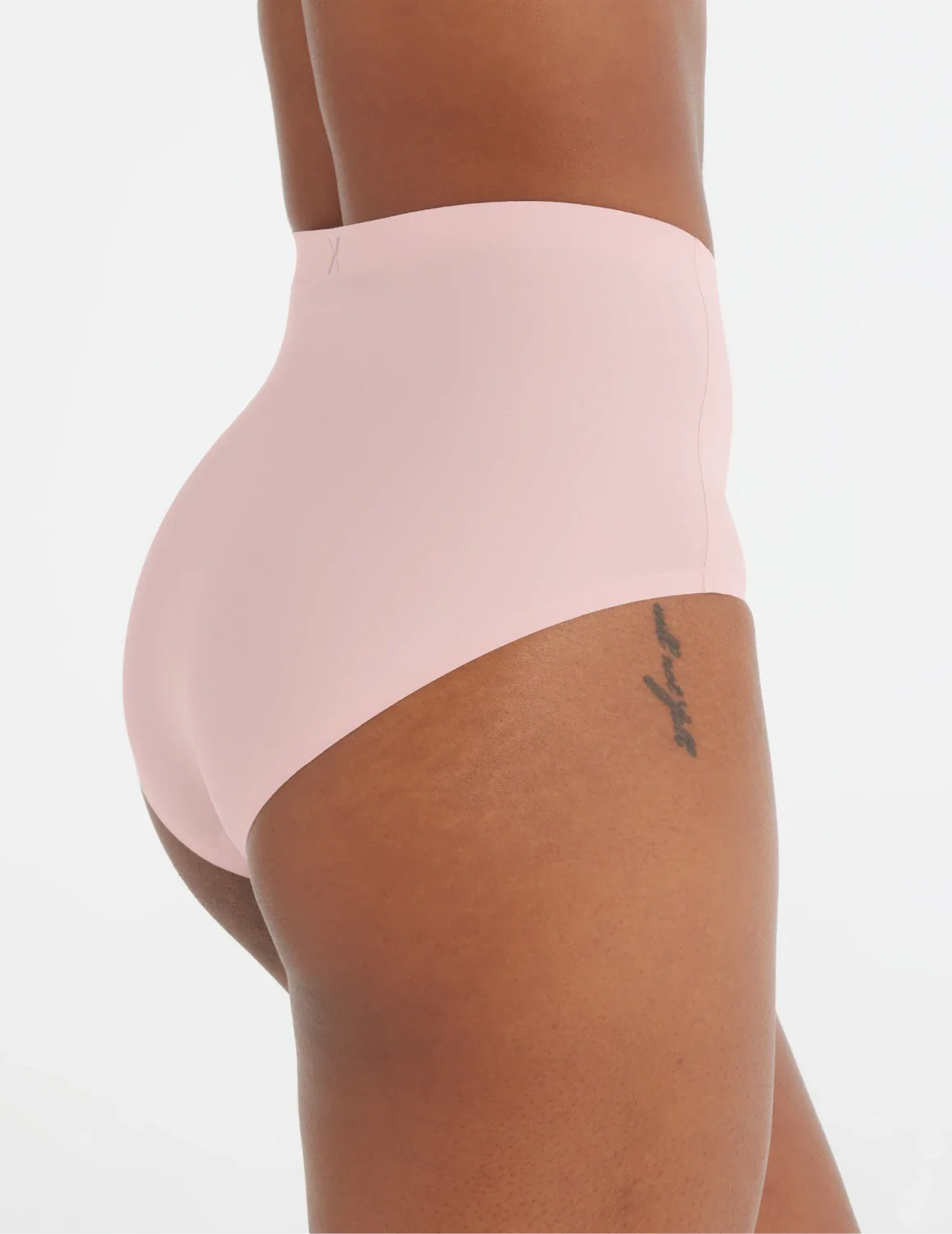 Side view of model wearing the Light Leakproof No-Show High Rise highlighting the coverage and smooth fit – Rose Water – view 11 of 20