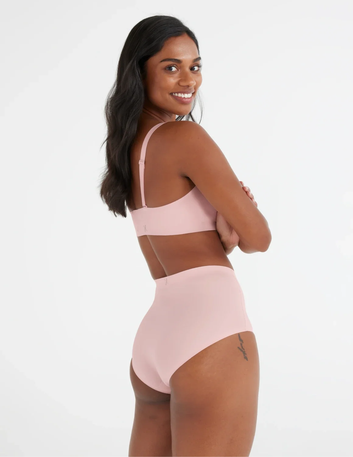 Full-body view of model wearing the Light Leakproof No-Show High Rise highlighting the coverage and smooth fit – Rose Water – view 12 of 20