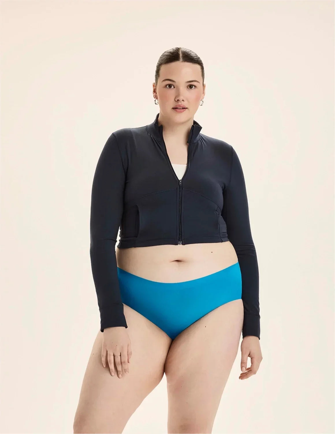 Front view of model wearing the Teen Light Leakproof No-Show Boyshort highlighting the coverage and smooth fit – Marina – view 4 of 93