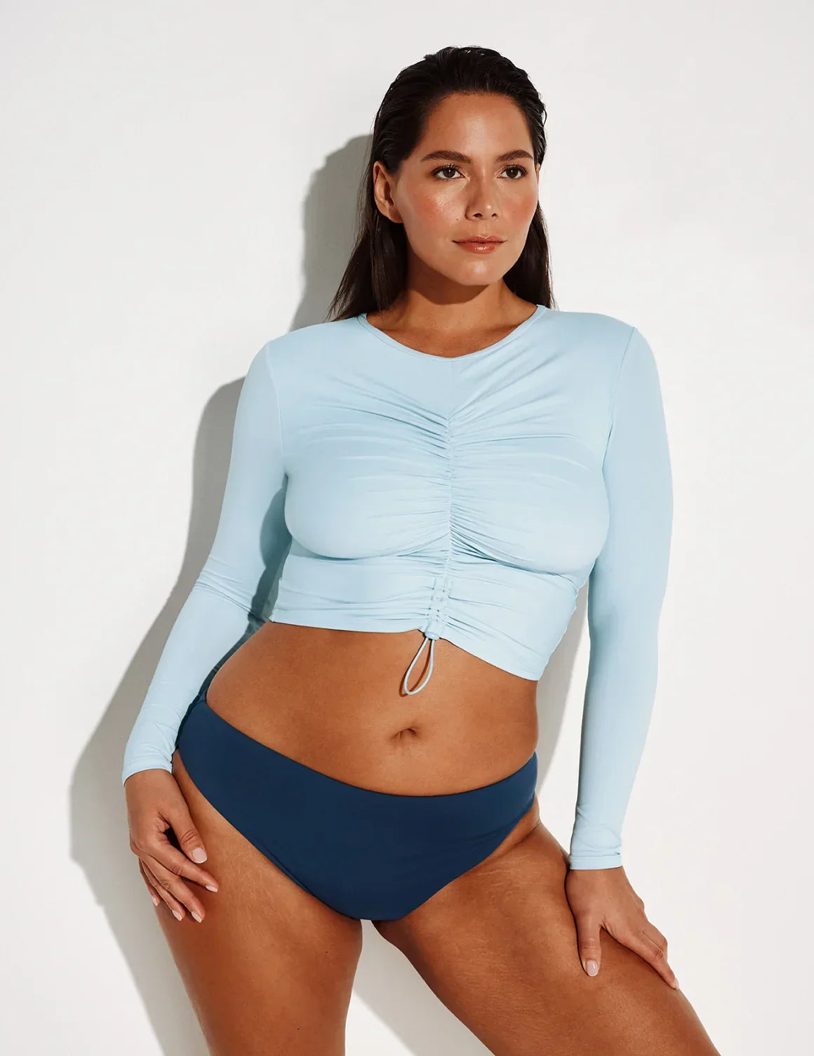 Front view of model wearing the Ruched Long Sleeve Swim Top highlighting the coverage and fit – Blue Ice – view 10 of 18