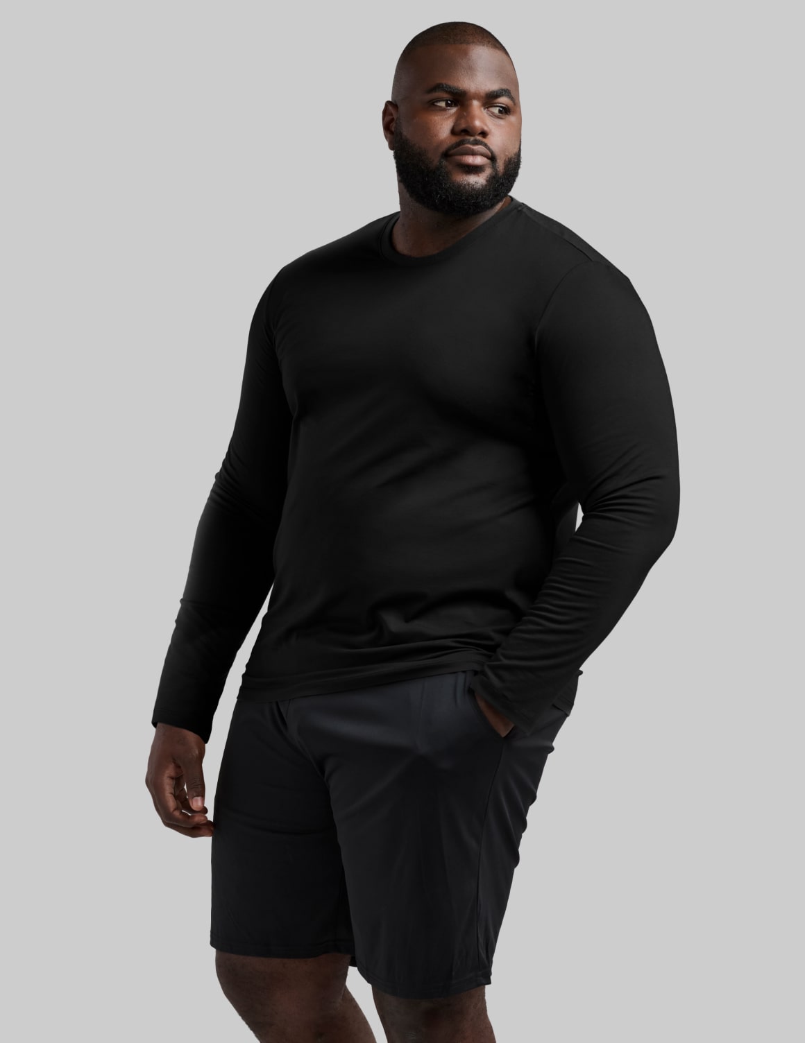 Front view of model wearing the Men's CoolShift™ Long Sleeve highlighting the coverage and fit – Black – view 1 of 13