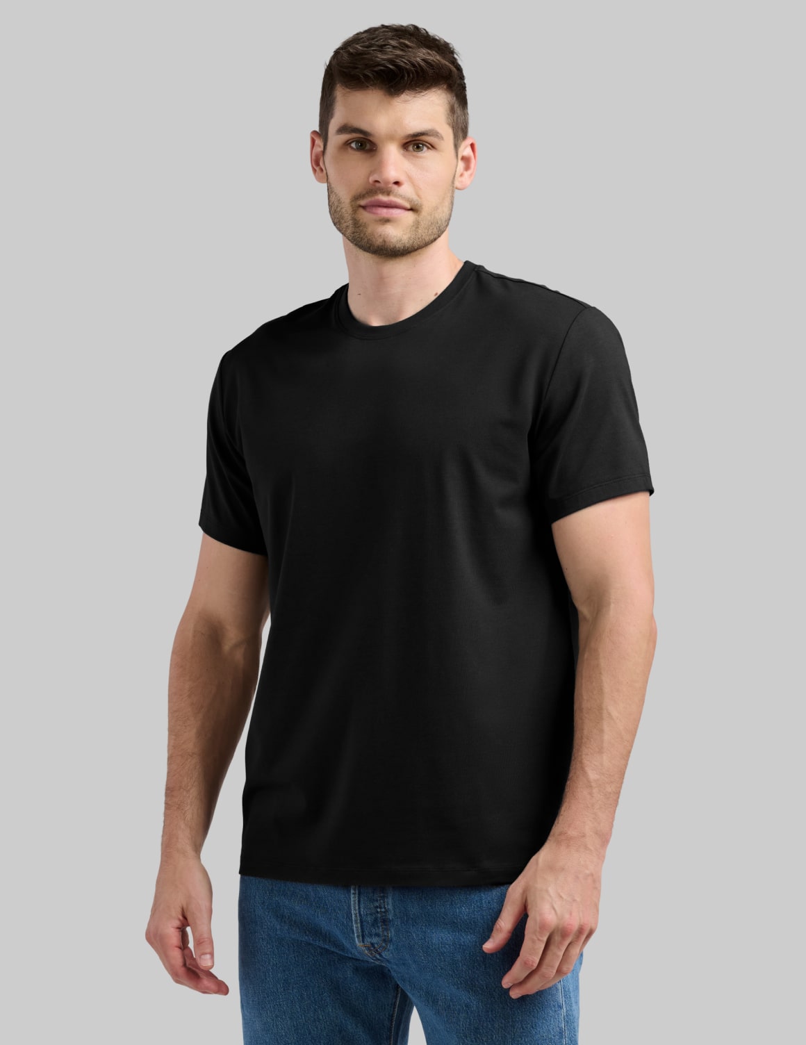 Front view of model wearing the Men's Relaxed Fit Best Damn Tee highlighting the coverage and fit – Black – view 1 of 27
