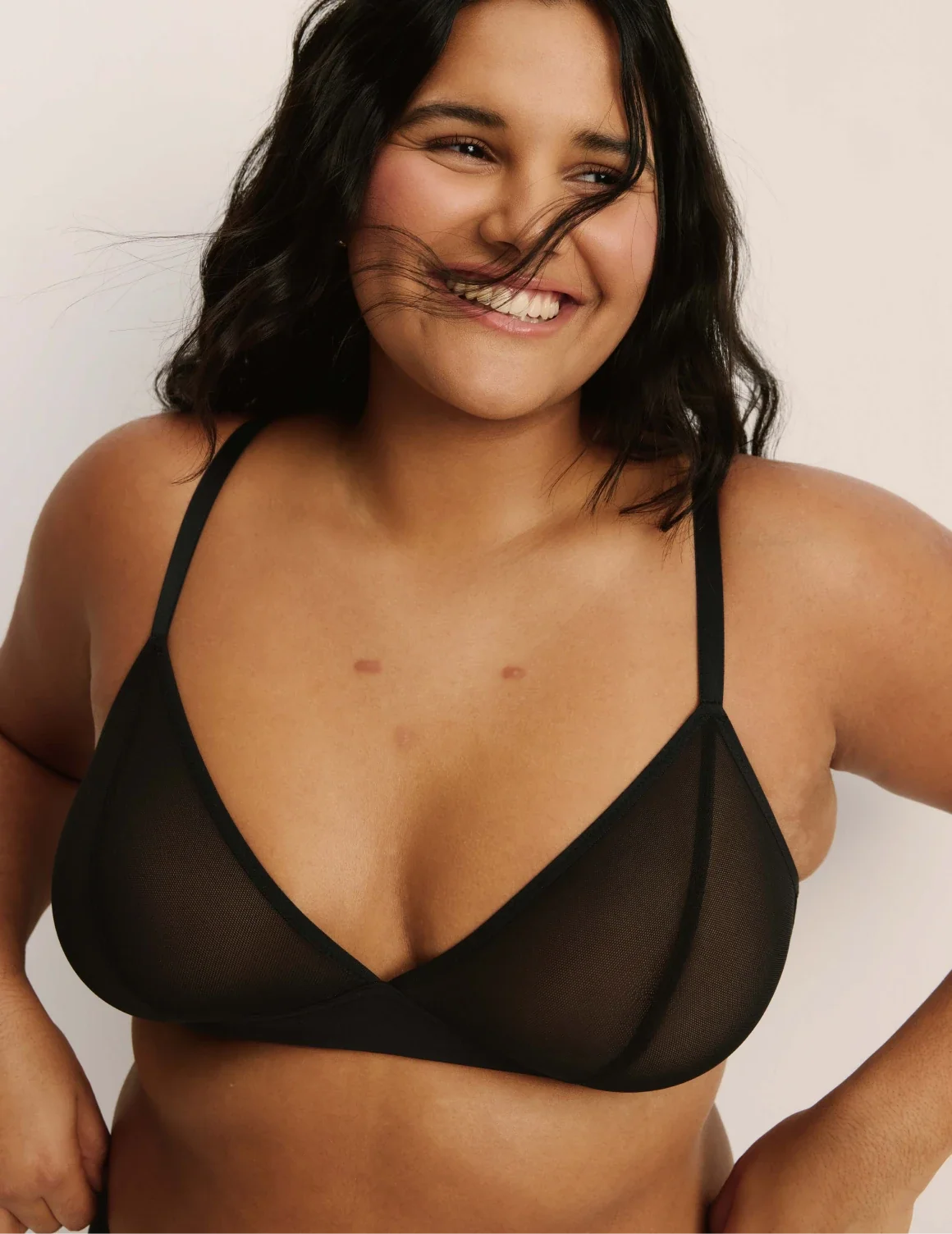 Front view of model wearing the Mesh Deep V Bra, highlighting the neckline, strap design, and smooth silhouette – Black – view 1 of 42