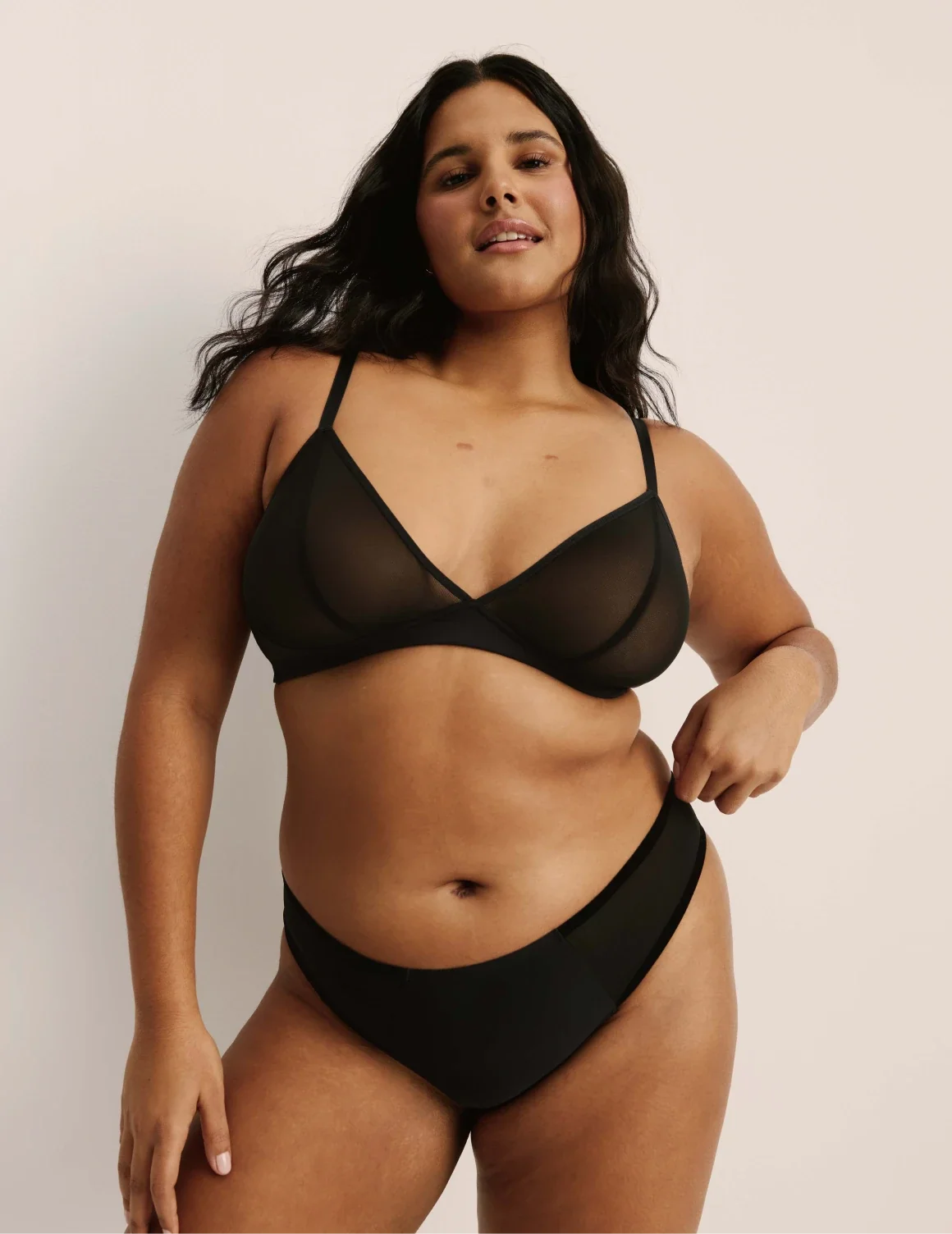 Full-body view of model wearing the Mesh Deep V Bra, highlighting the neckline, strap design, and smooth silhouette – Black – view 4 of 42