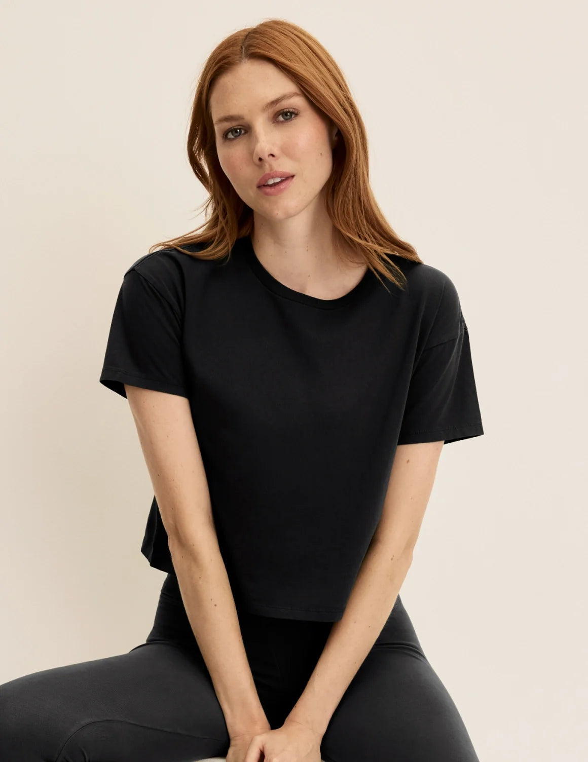 Front view of model wearing the Mineral-Dyed Cotton T-Shirt highlighting the coverage and fit – Washed Black – view 1 of 18