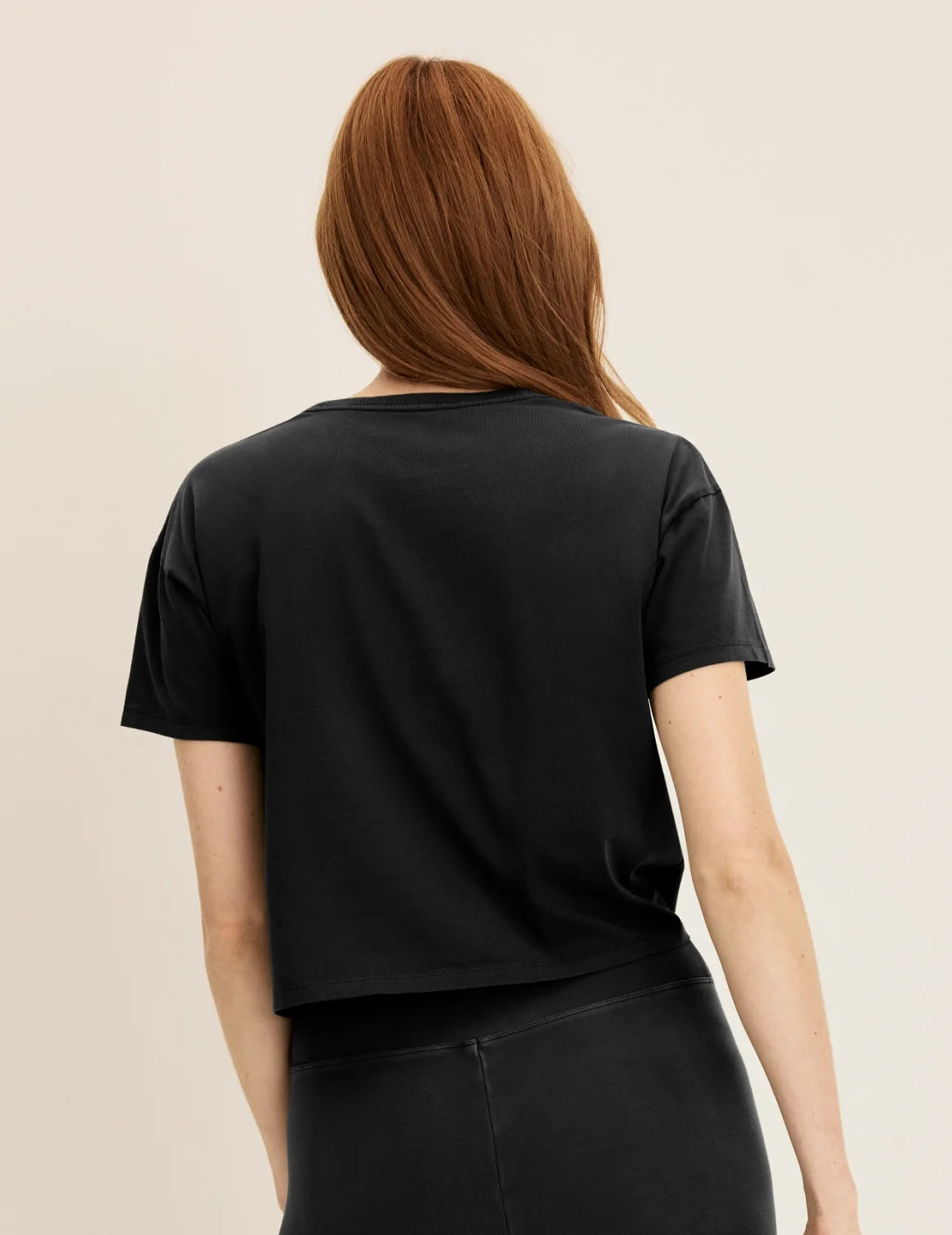 Back view of model wearing the Mineral-Dyed Cotton T-Shirt highlighting the coverage and fit – Washed Black – view 3 of 18