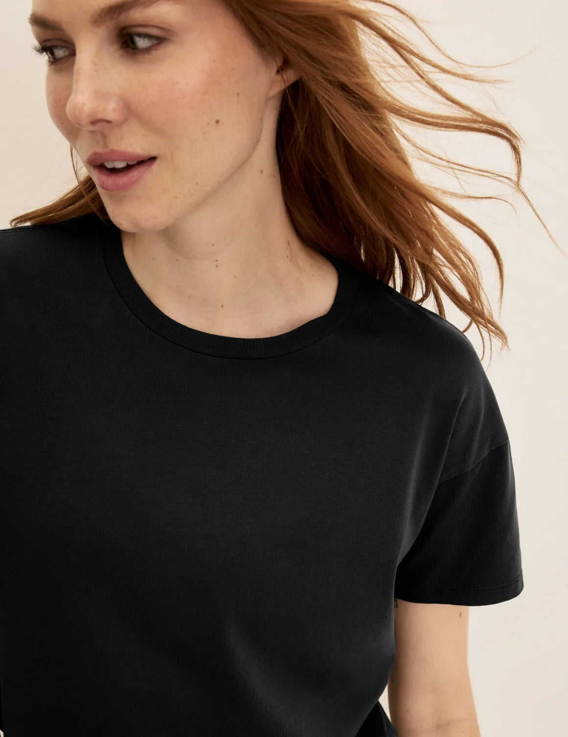 Front view of model wearing the Mineral-Dyed Cotton T-Shirt highlighting the coverage and fit – Washed Black – view 4 of 18
