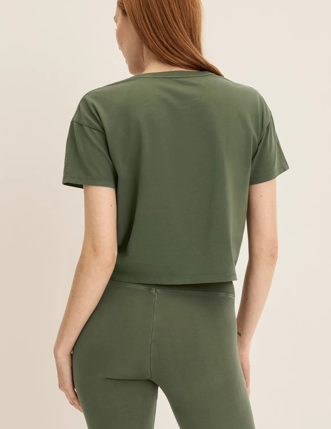 Back view of model wearing the Mineral-Dyed Cotton T-Shirt highlighting the coverage and fit – Washed Olive – view 12 of 18