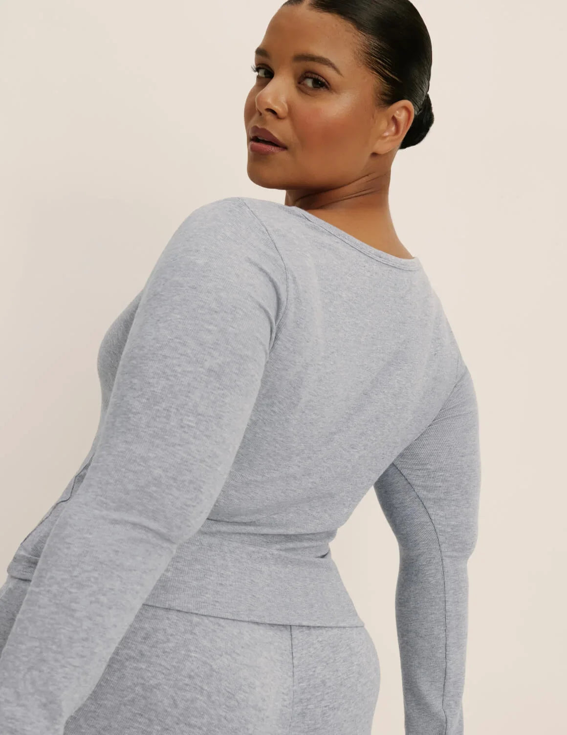 Back view of model wearing the Modal Rib Long Sleeve Henley highlighting the coverage and fit – Heathered Grey – view 5 of 17