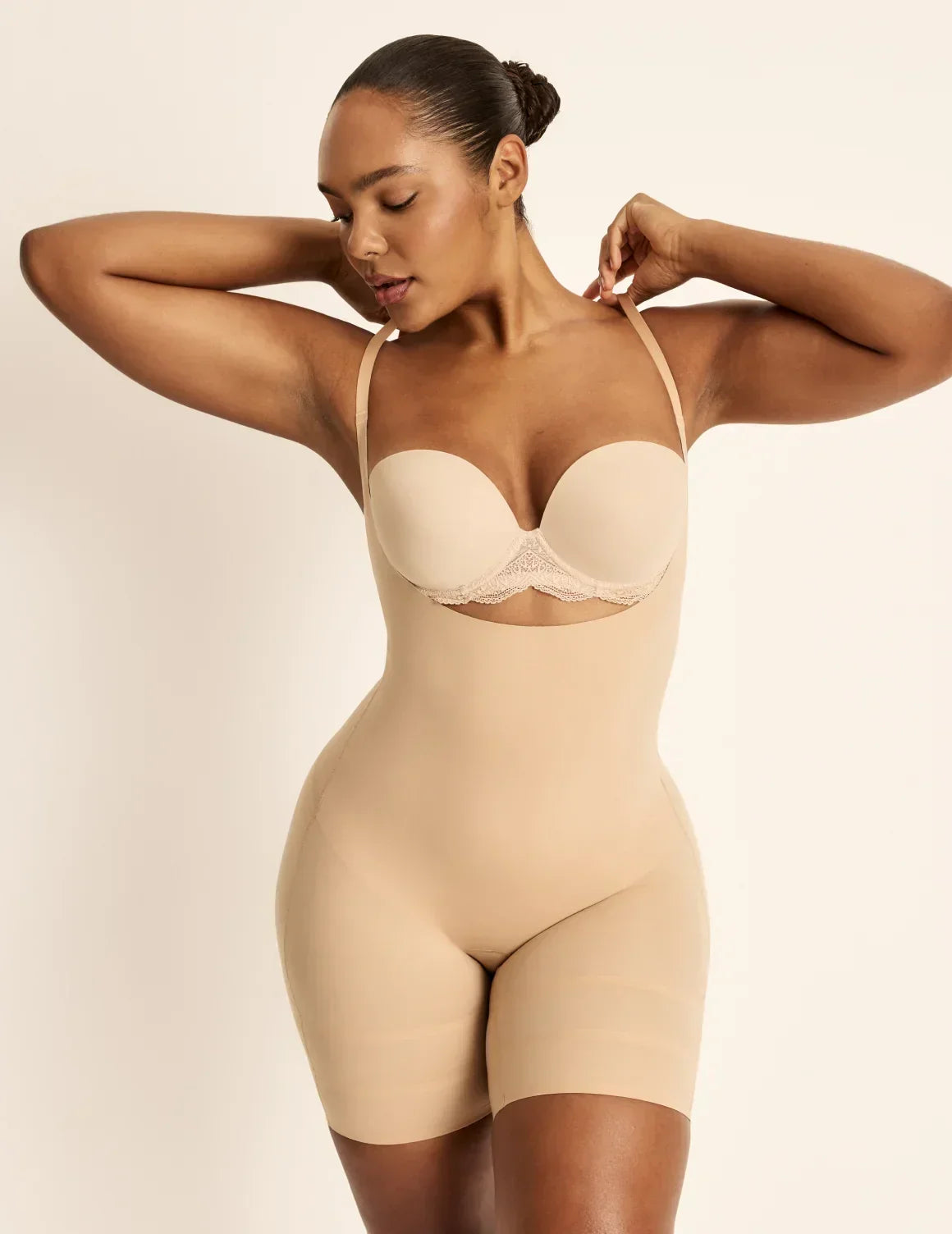 Front view of model wearing the Customizable Open Bust Shaper Bodysuit highlighting the coverage and smooth fit – Warm Sand – view 3 of 19