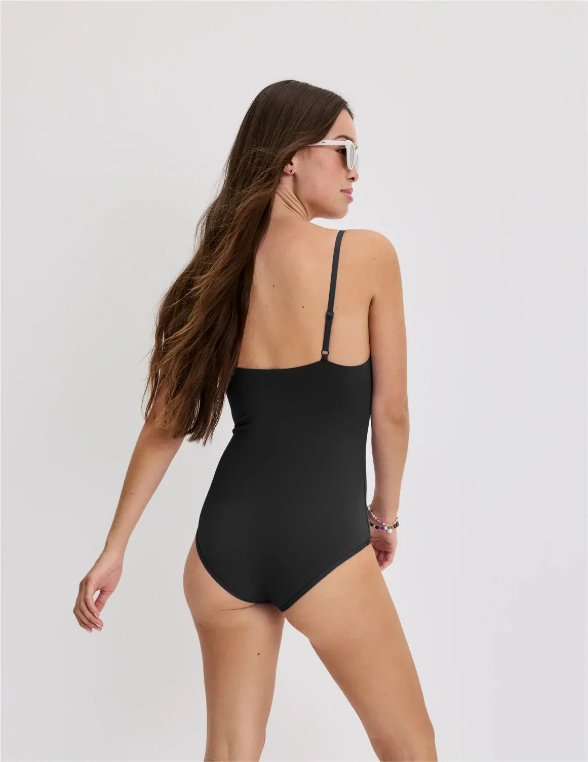 Back view of model wearing the Teen Period Swim Square Neck One-Piece highlighting the coverage and fit – Black – view 7 of 46