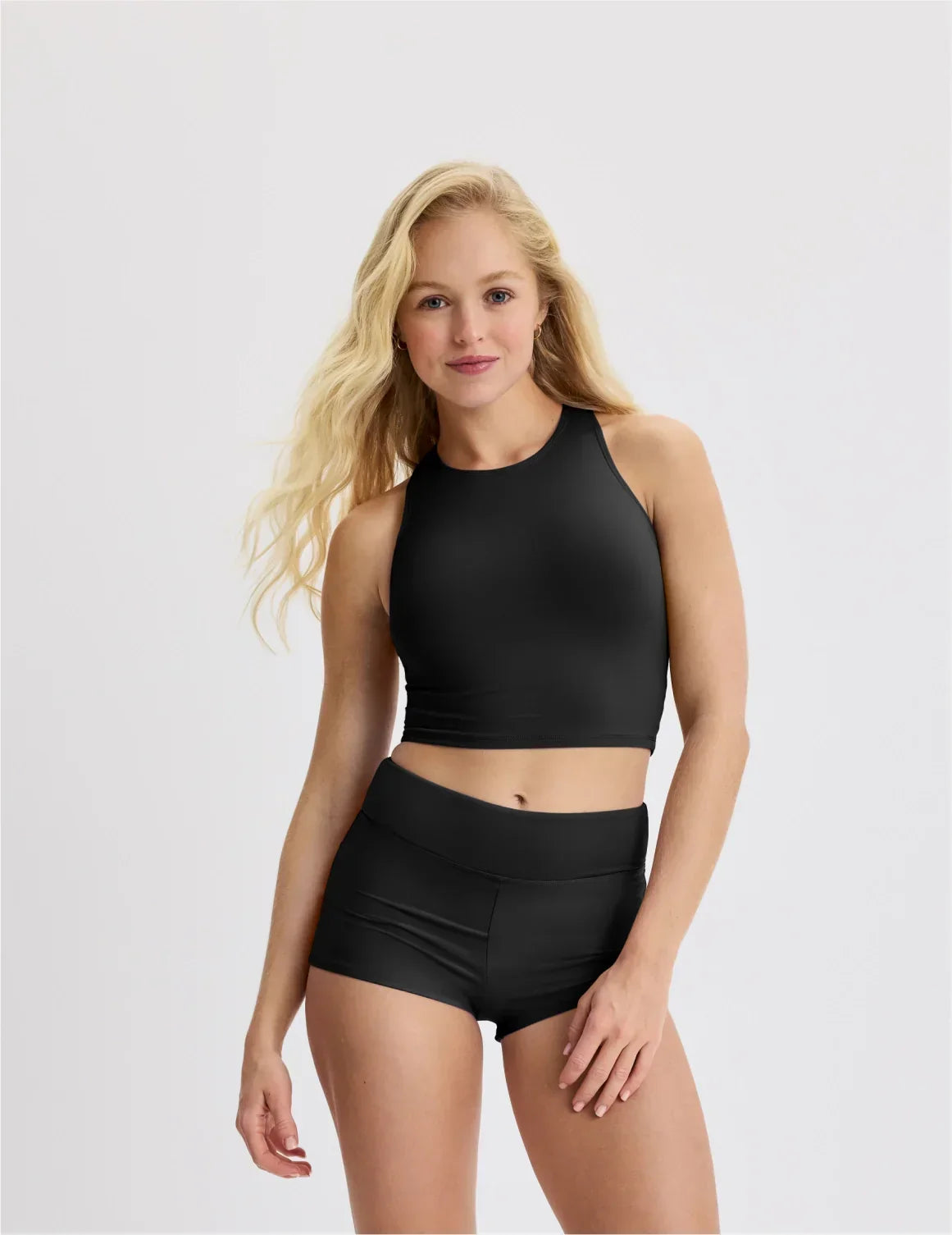Front view of model wearing the Teen Racerback Tankini Swim Top highlighting the coverage and fit – Black – view 10 of 45