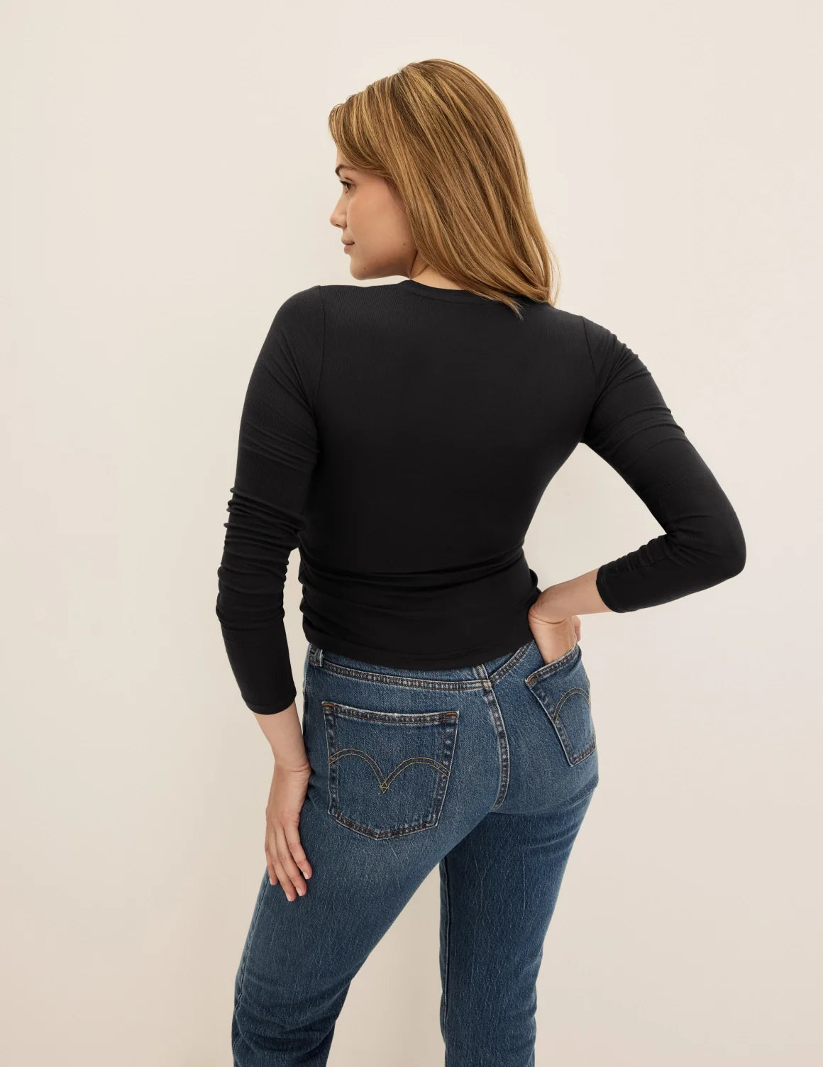 Back view of model wearing the Modal Rib Long Sleeve highlighting the coverage and fit – Black – view 3 of 21