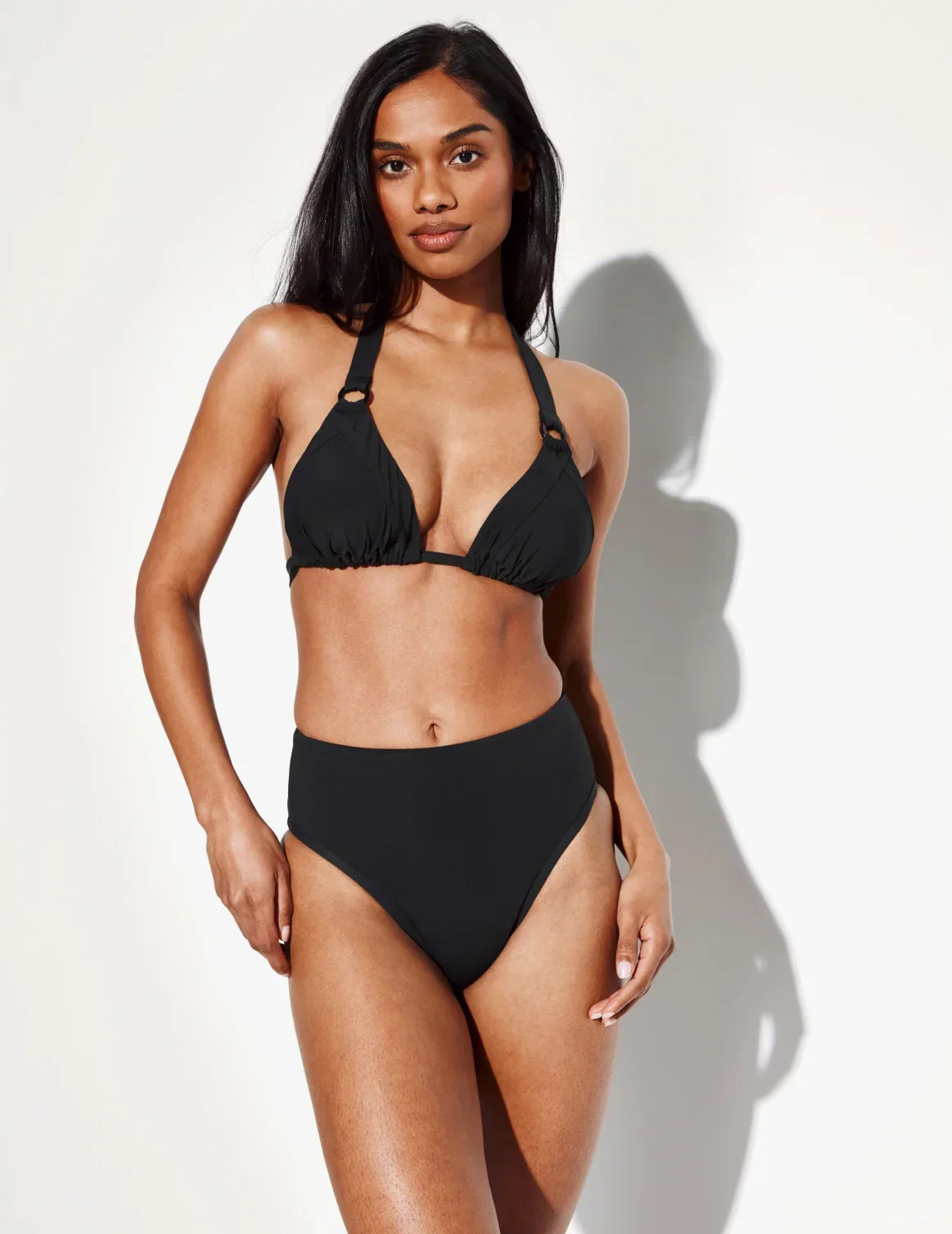 Front view of model wearing the Sculpt High Rise Bikini Swim Bottom highlighting the coverage and fit – Black – view 12 of 36