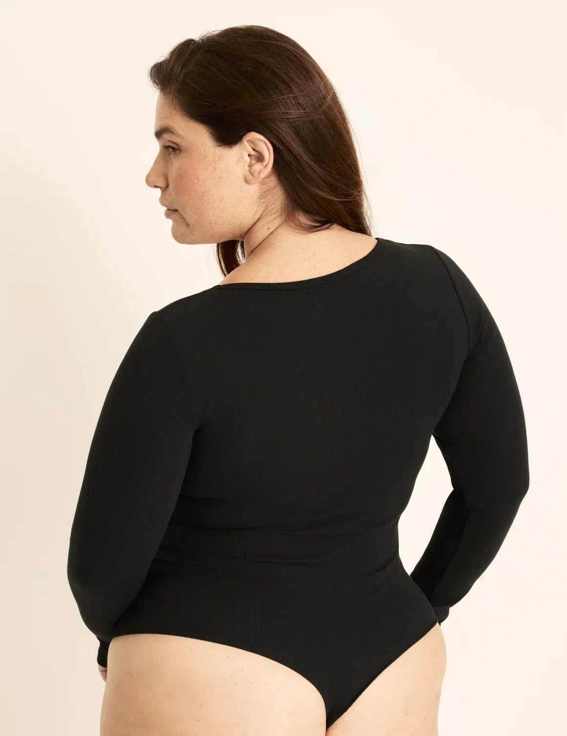 Back view of model wearing the SculptRib™ Cotton Bodysuit highlighting the neckline, fabric and hugging fit – Black – view 8 of 13