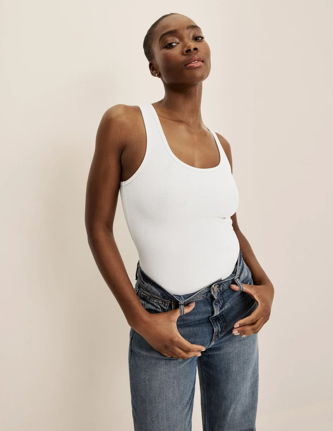 Front view of model wearing the SculptRib™ Cotton Tank Bodysuit highlighting the neckline, fabric and hugging fit – White – view 1 of 11