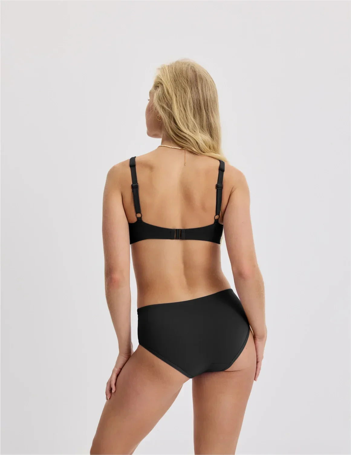 Back view of model wearing the Teen Square Neck Scoop Bikini Top highlighting the coverage and fit – Black – view 7 of 28