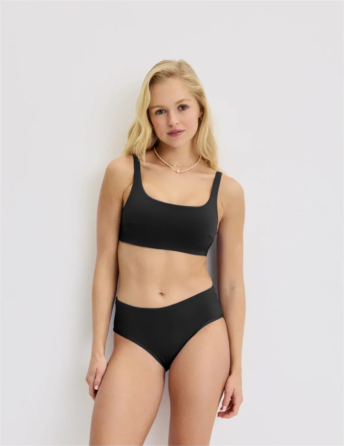 Front view of model wearing the Teen Square Neck Scoop Bikini Top highlighting the coverage and fit – Black – view 10 of 28