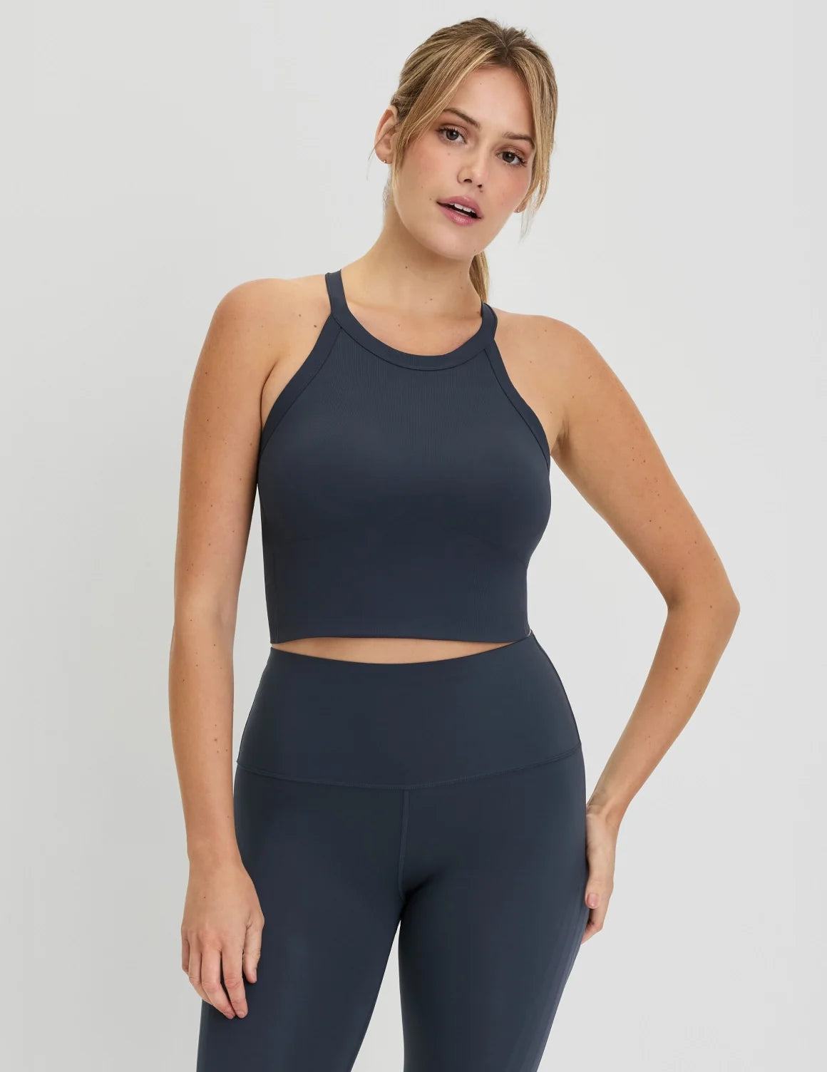 Front view of model wearing the Studio Ribbed Bra Top, highlighting the neckline, design, and silhouette – Twilight Navy – view 11 of 19