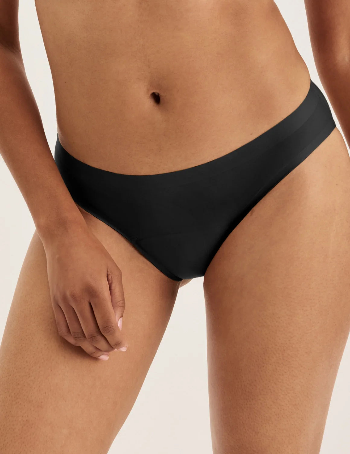 Front view of model wearing the Super Leakproof® No-Show Bikini highlighting the coverage and smooth fit – Black – view 1 of 29