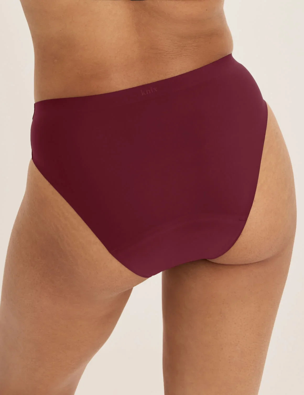 Back view of model wearing the Super Leakproof® No-Show French Cut highlighting the coverage and smooth fit – Dark Cherry – view 12 of 27