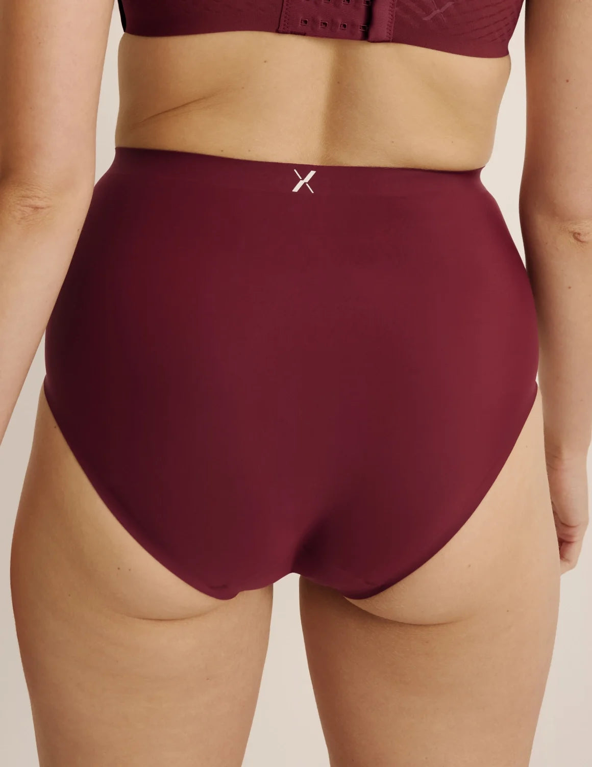 Back view of model wearing the Super Leakproof® No-Show High Rise highlighting the coverage and smooth fit – Dark Cherry – view 12 of 27