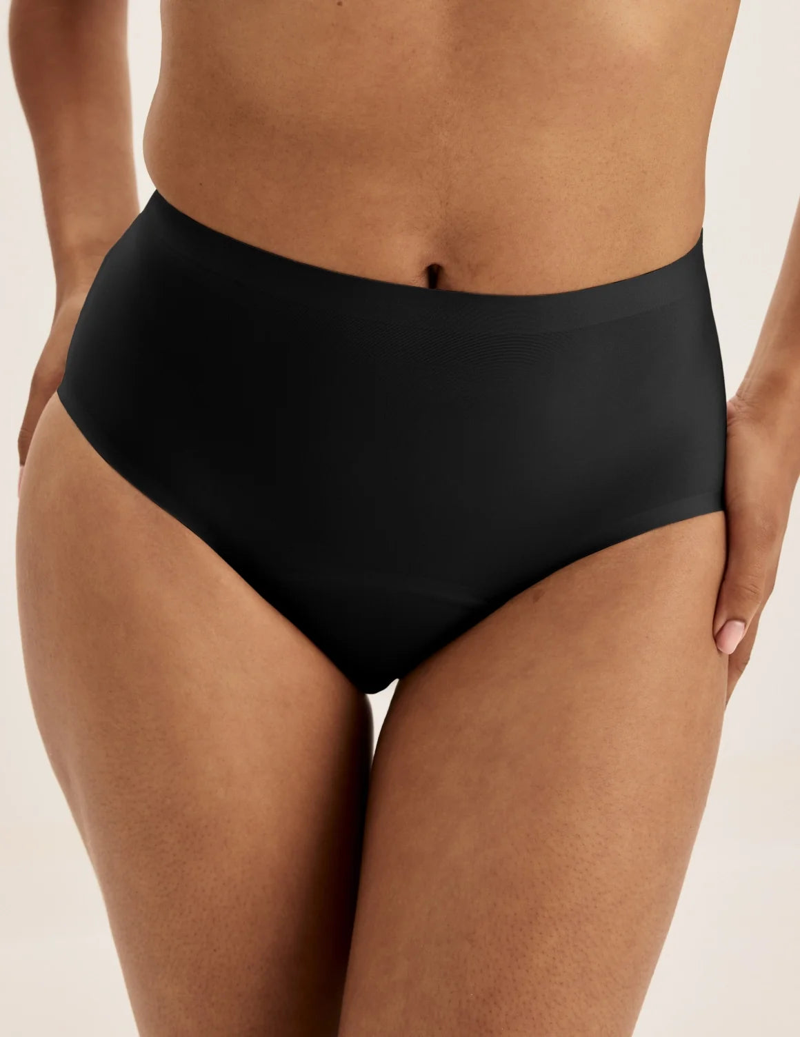 Front view of model wearing the Super Leakproof® No-Show High Rise highlighting the coverage and smooth fit – Black – view 1 of 27