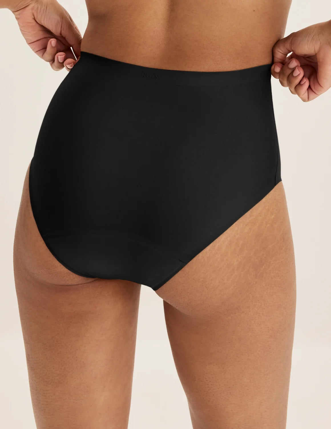 Back view of model wearing the Super Leakproof® No-Show High Rise highlighting the coverage and smooth fit – Black – view 3 of 27