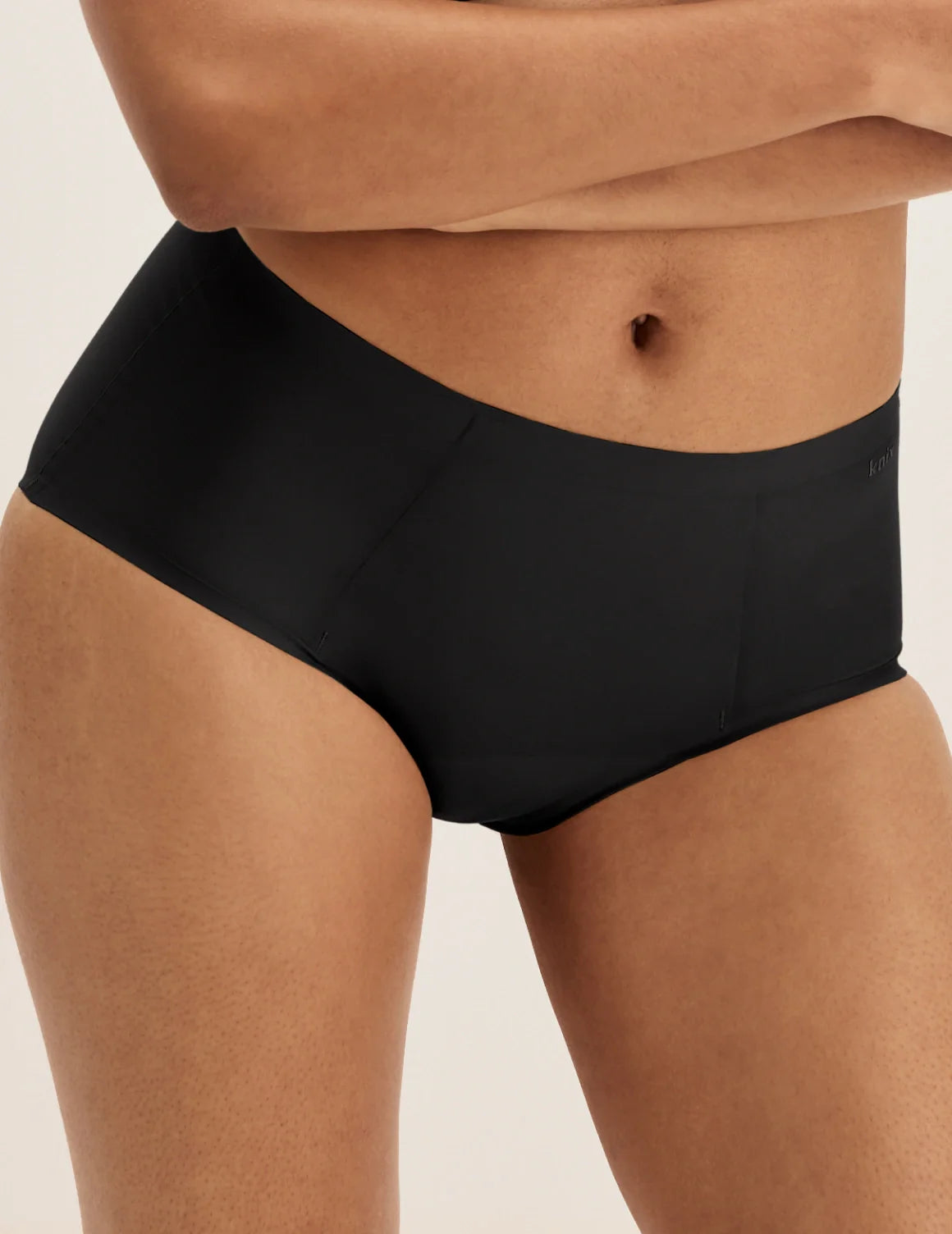 Front view of model wearing the SuperPlus Leakproof® No-Show Boybrief highlighting the coverage and smooth fit – Black – view 1 of 17