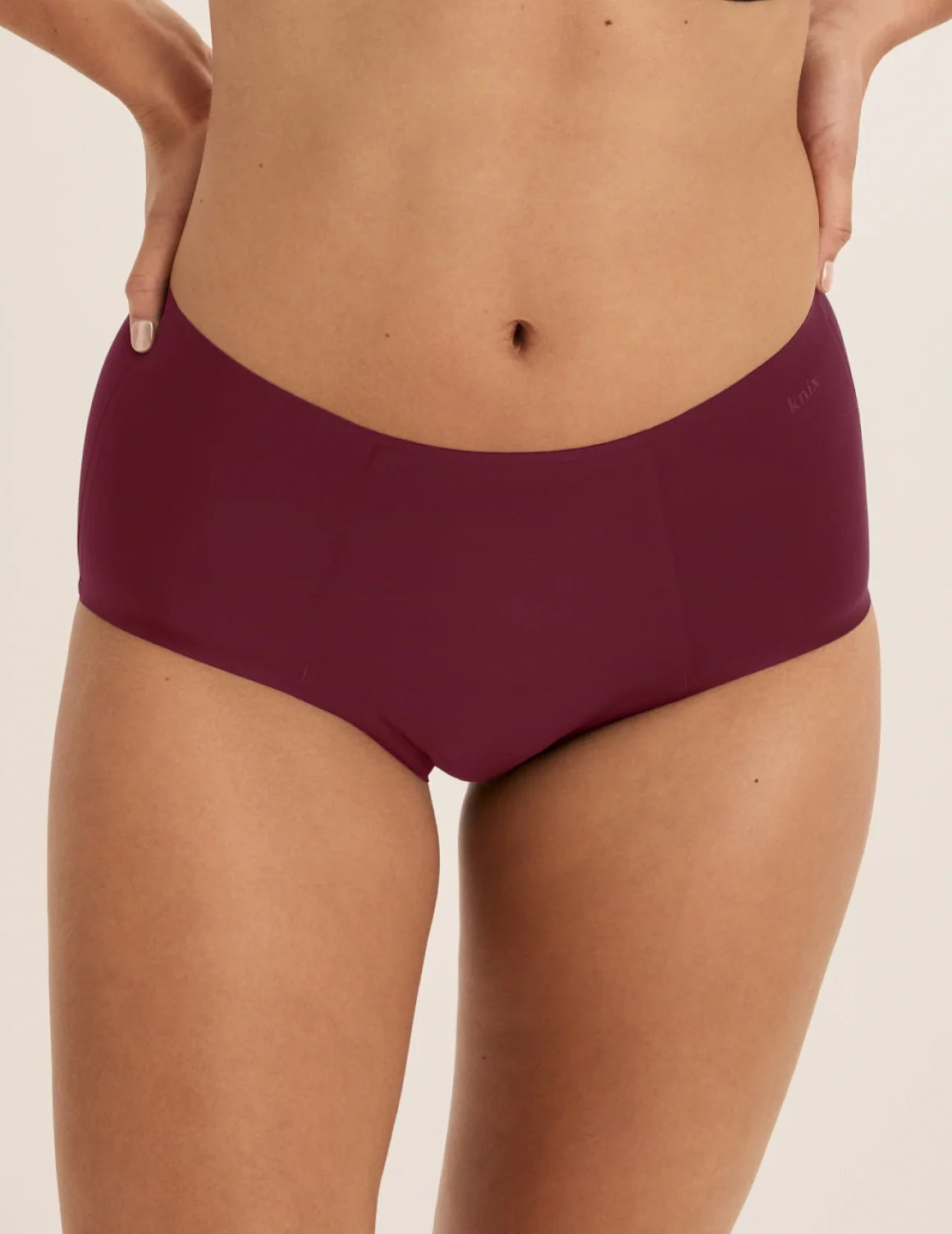 Front view of model wearing the SuperPlus Leakproof® No-Show Boybrief highlighting the coverage and smooth fit – Dark Cherry – view 4 of 17