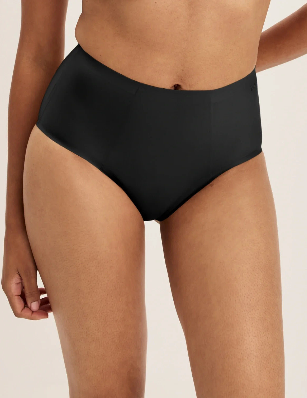 Front view of model wearing the SuperPlus Leakproof® No-Show High Rise highlighting the coverage and smooth fit – Black – view 1 of 21